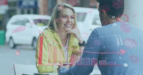 Couple Discussing Business with Technology Overlay in Cafe
