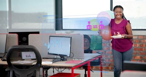 Office birthday celebration with colleague holding cake and balloons, ar data overlay