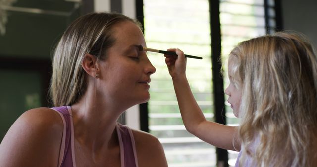 Mother and Daughter Engaging in Makeup Activity at Home - Download Free Stock Images Pikwizard.com