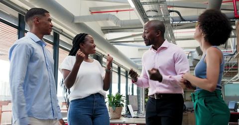 Diverse Team Collaborating in Modern Loft Office Environment