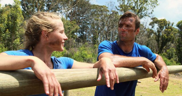 Muddy Couple Taking a Break During Outdoor Workout - Download Free Stock Images Pikwizard.com