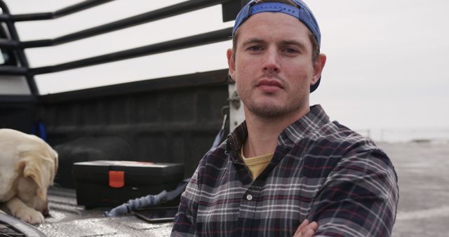 Young Man in Blue Cap and Plaid Shirt Outdoors Near Truck - Download Free Stock Images Pikwizard.com