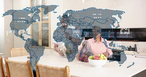 Couple holding reusable mesh produce bags in modern kitchen with ar world map overlay