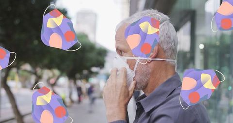 Senior man wearing face mask outdoors amid covid-19 concepts