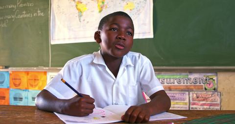 Engaged African American Student Writing in Classroom - Download Free Stock Images Pikwizard.com