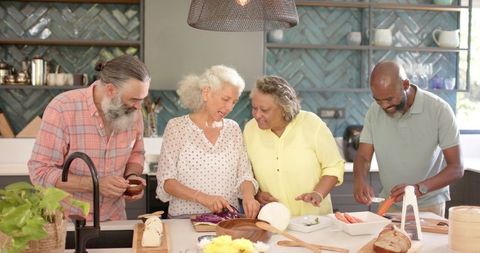 Senior Friends Cooking and Bonding in Modern Kitchen