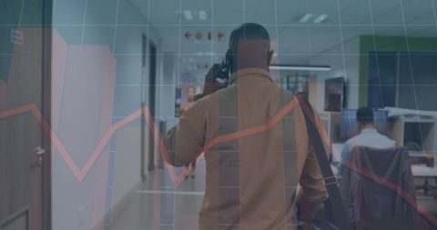 businessman on phone amid graph overlay in office - Download Free Stock Images Pikwizard.com