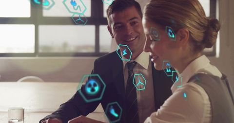 Business colleagues collaborating with augmented reality analytics overlay and dashboards