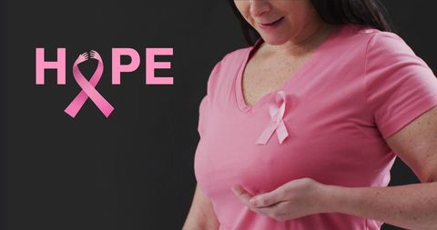 Breast Cancer Awareness: Woman with Pink Hope Ribbon on Black Background
