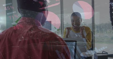 Diverse Business Analysts Celebrating Successful Data Insights