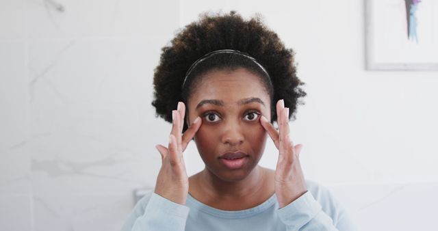 Woman Massaging Facial Muscles for Skincare Routine - Download Free Stock Images Pikwizard.com