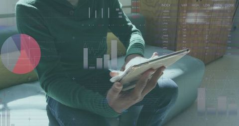 Business Professional Analyzing Statistical Data on Digital Tablet