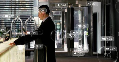 Business traveler checking phone at hotel lobby with suitcase and 5g ar overlays