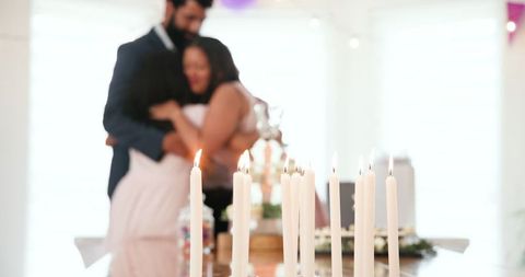 Family Embracing in Romantic Candlelit Ceremony Celebrating Tradition at Home