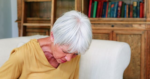 Senior Woman Suffering from Abdominal Pain at Home - Download Free Stock Images Pikwizard.com