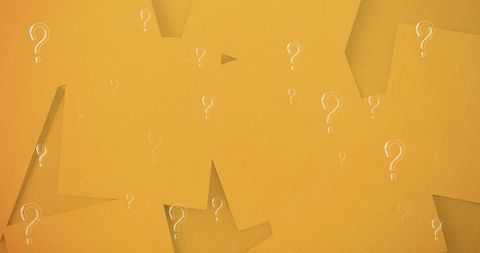 Question marks on yellow blank notes background
