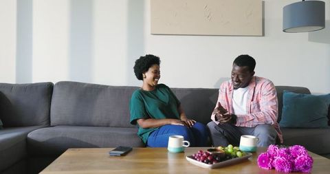 Romantic proposal on cozy sofa setting