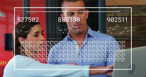 Business Professionals Analyzing Data on Digital Screen