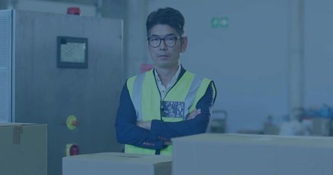 Warehouse Supervisor Wearing Hi-Vis Vest and Blazer Conducting Safety Inspection at Control Panel