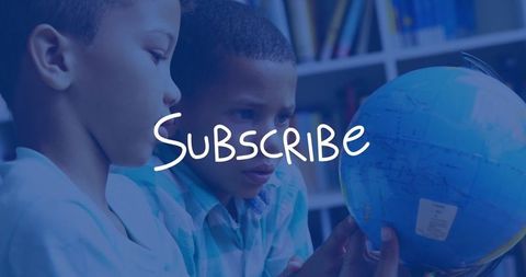 Curious boys exploring globe in library for educational learning