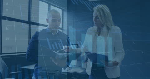 Business Colleagues Analyzing Financial Data with Technology