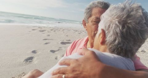 Senior Couple Embracing on Seaside Being Romantic
