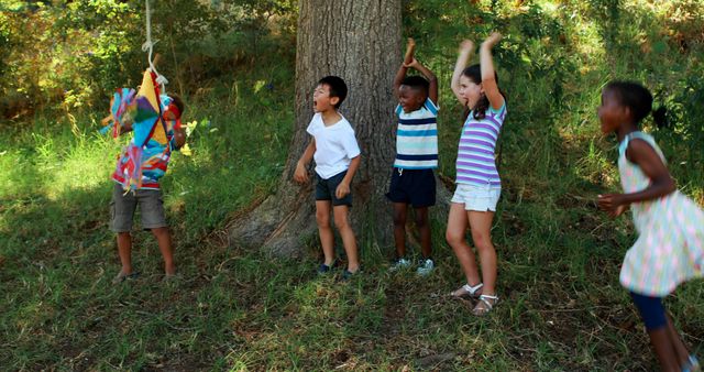 Children playing piñata game in park - Download Free Stock Images Pikwizard.com