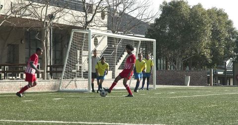 Youth Soccer Players Competing in Intense School Match