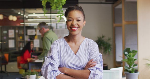 Happy African American Businesswoman Smiling in Modern Office - Download Free Stock Images Pikwizard.com