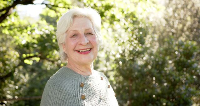 Smiling Elderly Woman Enjoying Sunny Day in Nature - Download Free Stock Images Pikwizard.com