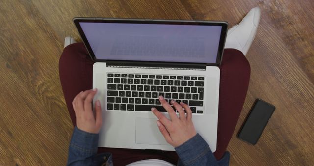 Person Typing on Laptop with Mobile Phone Nearby - Download Free Stock Images Pikwizard.com