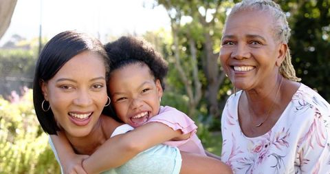 Diverse Family Generations Smiling in Beautiful Garden