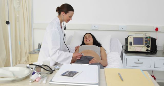 Pregnant Woman Receiving Medical Checkup by Female Doctor - Download Free Stock Images Pikwizard.com