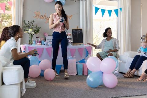 Diverse Friend Group Celebrating Baby Shower in Cozy Living Room