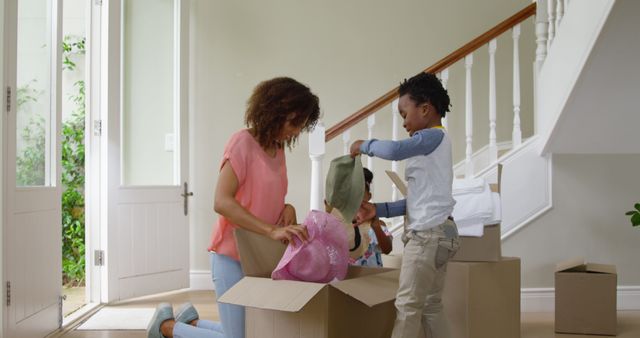 Family Unpacking in New Home Living Room with Boxes - Download Free Stock Images Pikwizard.com