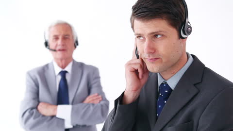 Professional Business Executives Using Headsets for Communication