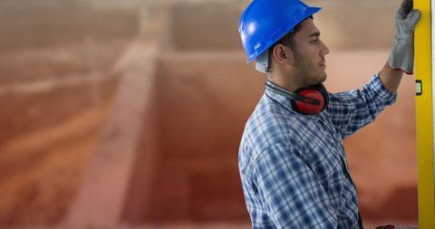 Construction Worker Using Level Tool at Building Site for Precision Work - Download Free Stock Images Pikwizard.com