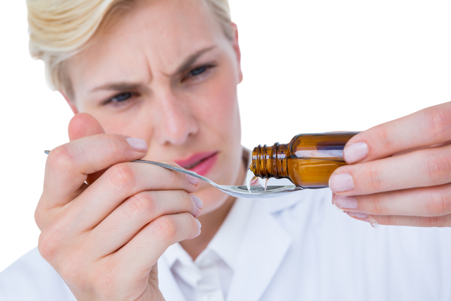 Doctor Pouring Medicine on Spoon with Focused Expression, Transparent Background - Download Free Stock Videos Pikwizard.com