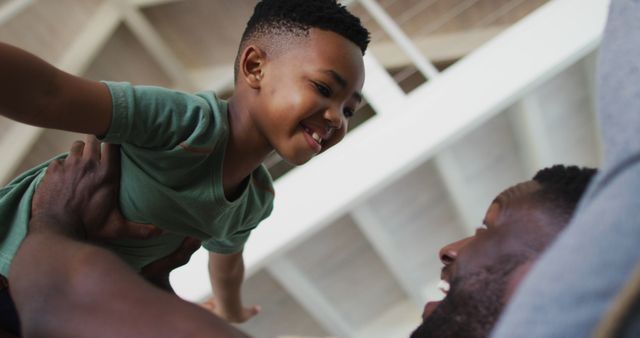 Joyful Father Lifting His Smiling Son Up in Air - Download Free Stock Images Pikwizard.com