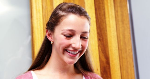 Smiling Young Woman with Brown Hair in Casual Pink Sweater - Download Free Stock Images Pikwizard.com