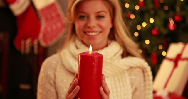 Woman Holding Red Candle During Christmas Celebration - Download Free Stock Images Pikwizard.com