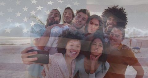 Friends Taking Selfie with American Flag Blur at Beach