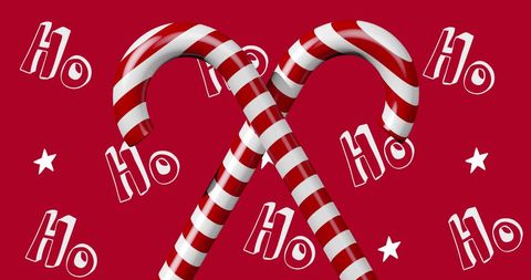 Festive Candy Canes and Ho Ho Ho on Red Holiday Background