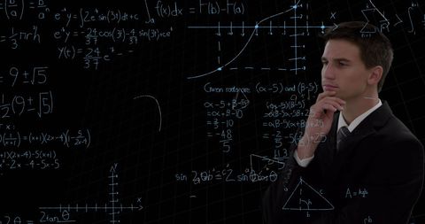 Businessman Analyzing Mathematical Formulas on Blackboard - Download Free Stock Images Pikwizard.com