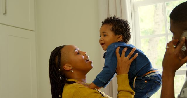 Happy African American Family Playing with Baby at Home - Download Free Stock Images Pikwizard.com