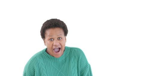 Surprised Woman with Open Mouth in Green Sweater