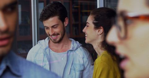 Young Adults Socializing and Smiling at Casual Gathering