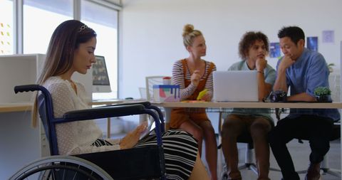 Caucasian Woman in Wheelchair Using Tablet in Collaborative Office - Download Free Stock Images Pikwizard.com