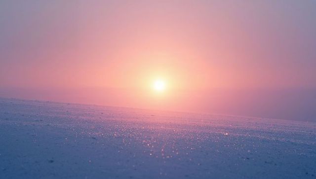 Pastel sunrise over sparkling frozen plain casting pink-purple glow, minimalist serene landscape
