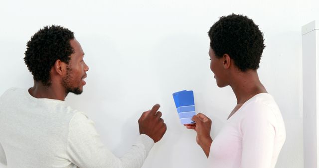 Couple Discussing Paint Color Choices for Home Renovation - Download Free Stock Images Pikwizard.com